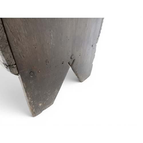 2020 - AN 18TH CENTURY OAK SWORD CHESTwith two plank hinged lid with wrought iron fittings on fret cut supp... 