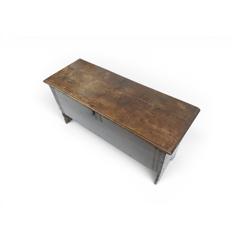 2020 - AN 18TH CENTURY OAK SWORD CHESTwith two plank hinged lid with wrought iron fittings on fret cut supp... 