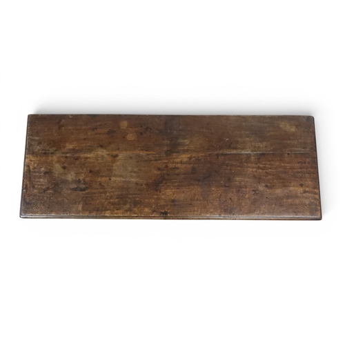 2020 - AN 18TH CENTURY OAK SWORD CHESTwith two plank hinged lid with wrought iron fittings on fret cut supp... 