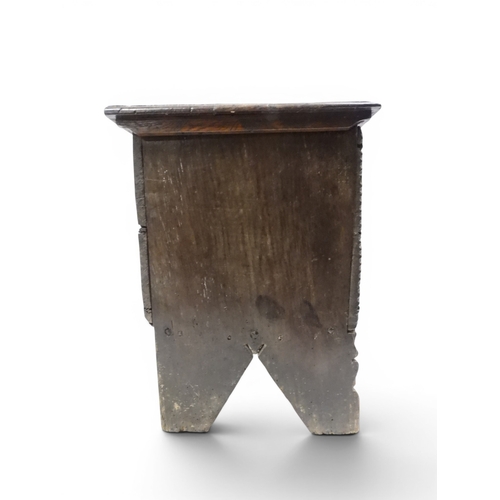 2020 - AN 18TH CENTURY OAK SWORD CHESTwith two plank hinged lid with wrought iron fittings on fret cut supp... 