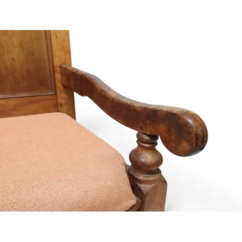 2021 - AN 18TH CENTURY OAK FIVE PANEL BACK SETTLEwith shaped scroll arms flanking later upholstered drop in... 