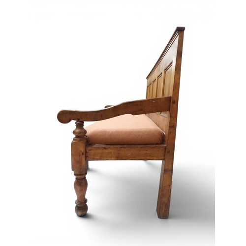 2021 - AN 18TH CENTURY OAK FIVE PANEL BACK SETTLEwith shaped scroll arms flanking later upholstered drop in... 
