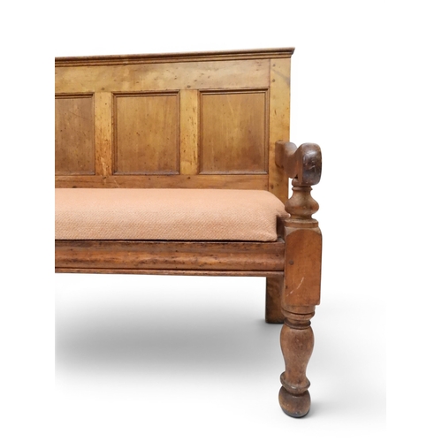 2021 - AN 18TH CENTURY OAK FIVE PANEL BACK SETTLEwith shaped scroll arms flanking later upholstered drop in... 