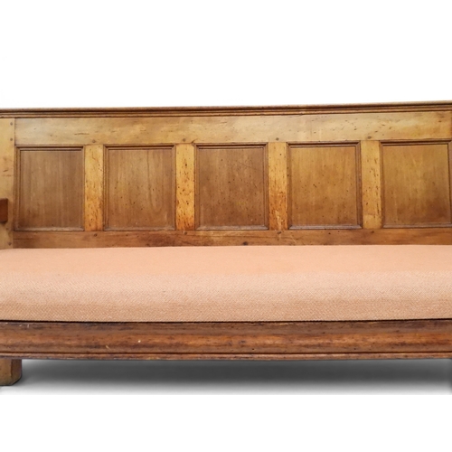 2021 - AN 18TH CENTURY OAK FIVE PANEL BACK SETTLEwith shaped scroll arms flanking later upholstered drop in... 