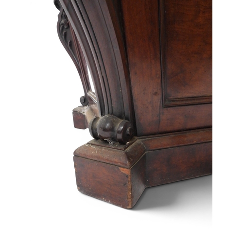 2057 - A 19TH CENTURY MAHOGANY SARCOPHAGUS FORM CELLARETTE with lead lined interior and carved scrolled can... 