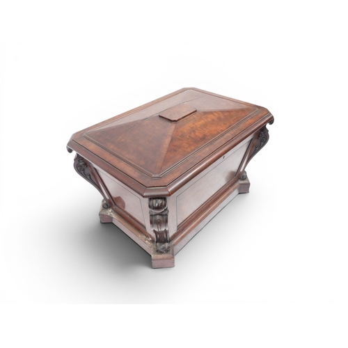 2057 - A 19TH CENTURY MAHOGANY SARCOPHAGUS FORM CELLARETTE with lead lined interior and carved scrolled can... 