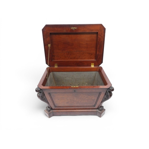 2057 - A 19TH CENTURY MAHOGANY SARCOPHAGUS FORM CELLARETTE with lead lined interior and carved scrolled can... 
