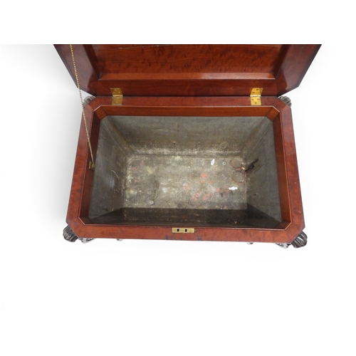 2057 - A 19TH CENTURY MAHOGANY SARCOPHAGUS FORM CELLARETTE with lead lined interior and carved scrolled can... 
