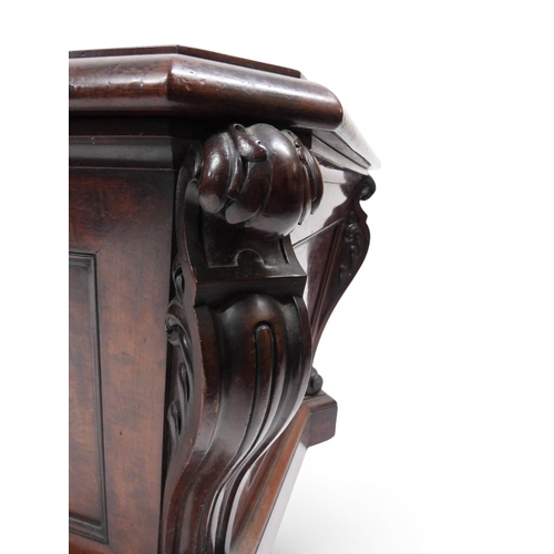2057 - A 19TH CENTURY MAHOGANY SARCOPHAGUS FORM CELLARETTE with lead lined interior and carved scrolled can... 