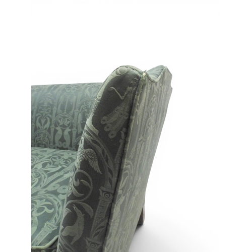 2058 - A LATE 19TH CENTURY GREEN UPHOLSTERED HUMPBACK SETTEE&nbsp;with raised arms on carved scrolled front... 