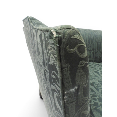 2058 - A LATE 19TH CENTURY GREEN UPHOLSTERED HUMPBACK SETTEE&nbsp;with raised arms on carved scrolled front... 