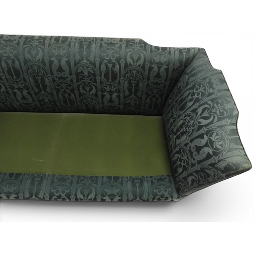 2058 - A LATE 19TH CENTURY GREEN UPHOLSTERED HUMPBACK SETTEE&nbsp;with raised arms on carved scrolled front... 