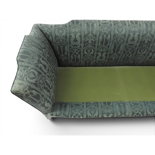 2058 - A LATE 19TH CENTURY GREEN UPHOLSTERED HUMPBACK SETTEE&nbsp;with raised arms on carved scrolled front... 