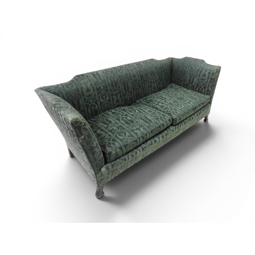 2058 - A LATE 19TH CENTURY GREEN UPHOLSTERED HUMPBACK SETTEE&nbsp;with raised arms on carved scrolled front... 
