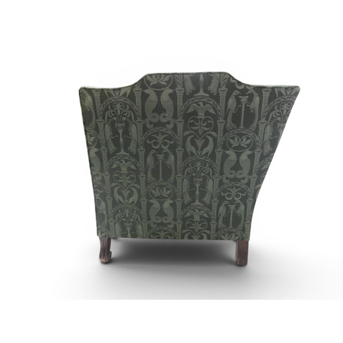2058 - A LATE 19TH CENTURY GREEN UPHOLSTERED HUMPBACK SETTEE&nbsp;with raised arms on carved scrolled front... 