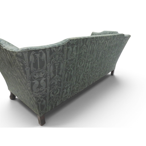 2058 - A LATE 19TH CENTURY GREEN UPHOLSTERED HUMPBACK SETTEE&nbsp;with raised arms on carved scrolled front... 
