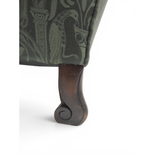 2058 - A LATE 19TH CENTURY GREEN UPHOLSTERED HUMPBACK SETTEE&nbsp;with raised arms on carved scrolled front... 