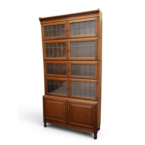 2003 - AN EARLY 20TH CENTURY MAHOGANY MINTY LIMITED, OXFORD FIVE TIER SECTIONAL BOOKCASEwith four pairs of ... 