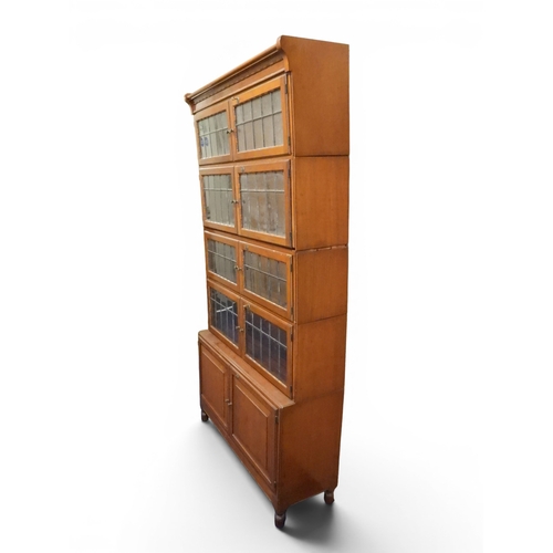 2003 - AN EARLY 20TH CENTURY MAHOGANY MINTY LIMITED, OXFORD FIVE TIER SECTIONAL BOOKCASEwith four pairs of ... 
