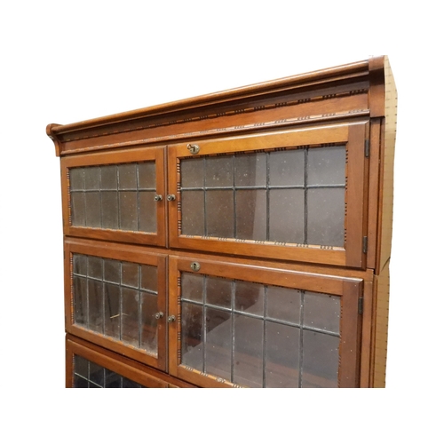 2003 - AN EARLY 20TH CENTURY MAHOGANY MINTY LIMITED, OXFORD FIVE TIER SECTIONAL BOOKCASEwith four pairs of ... 