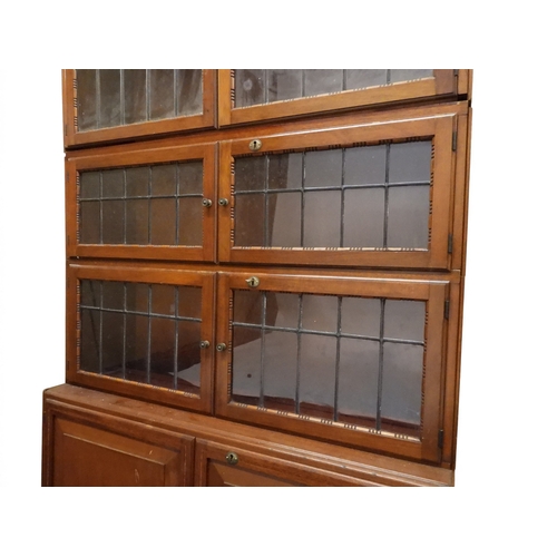 2003 - AN EARLY 20TH CENTURY MAHOGANY MINTY LIMITED, OXFORD FIVE TIER SECTIONAL BOOKCASEwith four pairs of ... 