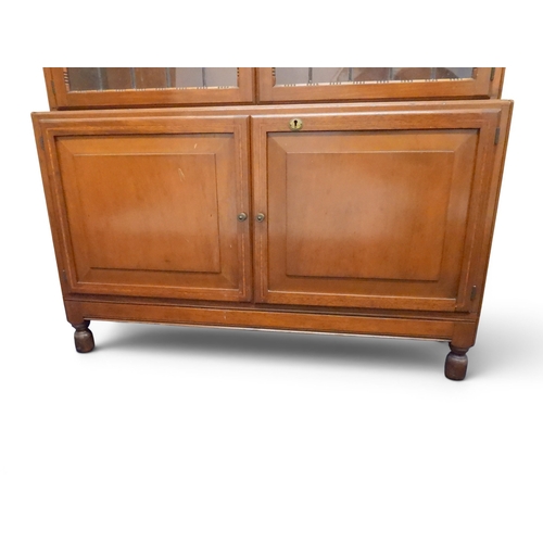 2003 - AN EARLY 20TH CENTURY MAHOGANY MINTY LIMITED, OXFORD FIVE TIER SECTIONAL BOOKCASEwith four pairs of ... 