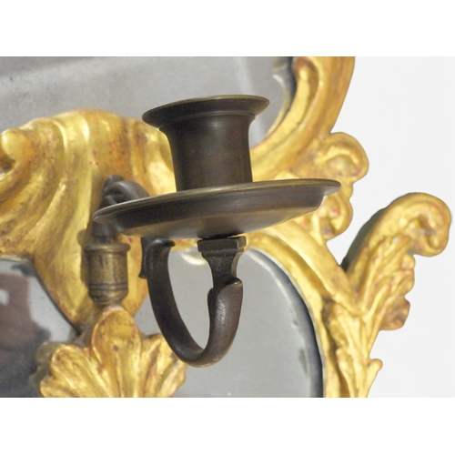 2013 - A PAIR OF 19TH CENTURY GILT GESSO FRAMED GIRANDOLE WALL MIRRORS&nbsp;with scrolled foliate decorated... 