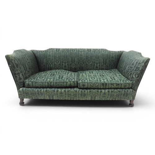 2058 - A LATE 19TH CENTURY GREEN UPHOLSTERED HUMPBACK SETTEE&nbsp;with raised arms on carved scrolled front... 