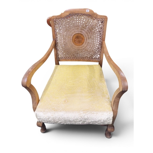 12 - An early 20th century walnut framed bergere three piece suite consisting two seat settee, 83cm high ... 