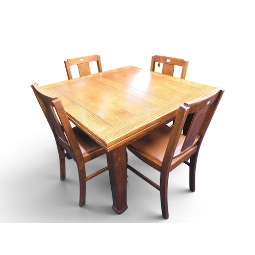 14 - An early 20th century oak pull out dining table and chairs, square topped table with two pull out le... 