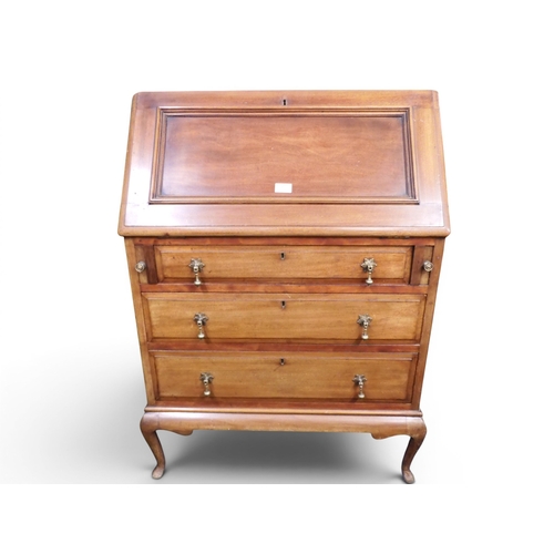 17 - An early 20th century mahogany writing bureau with fitted fall front writing compartment over three ... 