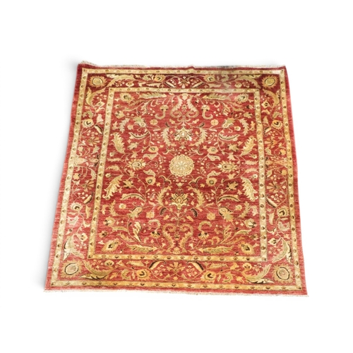 2 - A red ground Afghan Zeigler style rug with beige all over floral/foliate patterned ground within sim... 