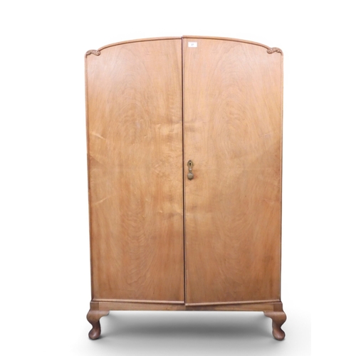 27 - A small dome top gents wardrobe with pair of doors concealing fitted interior on cabriole feet, 146c... 