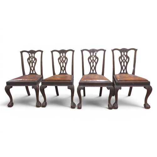 32 - A set of four 19th century mahogany framed Chippendale style dining chairs with pierced splats over ... 