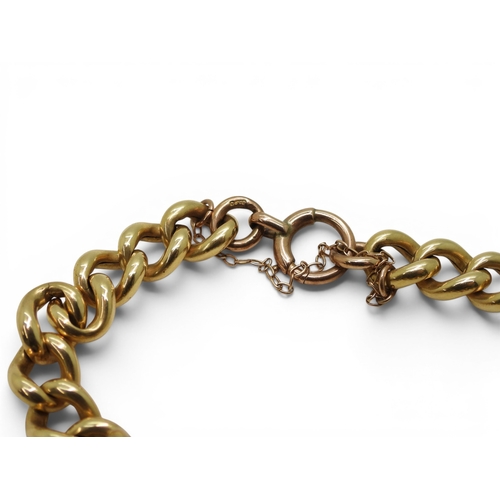 700 - A bright yellow metal curb chain bracelet, with a 9ct rose gold clasp and two attached Georgian fob ... 
