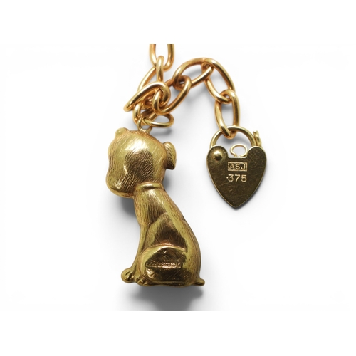 701 - A 9ct gold charm bracelet to include a 9ct Bonzo Dog charm, a horses head and a further 6 9ct charms... 
