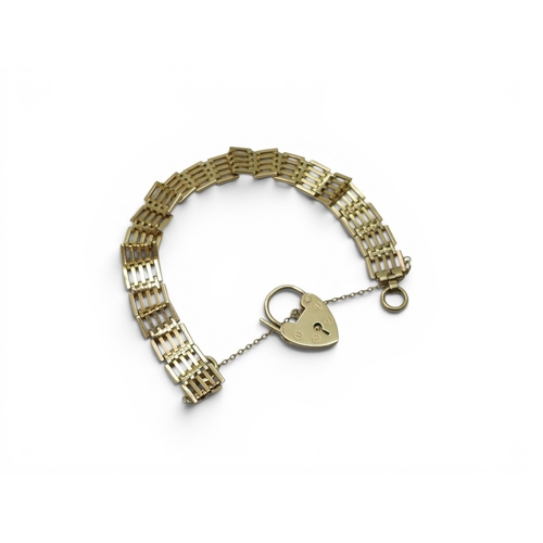706 - A 9ct gold gate bracelet, with heart shaped clasp, length 18.5cm, weight 16.1gms