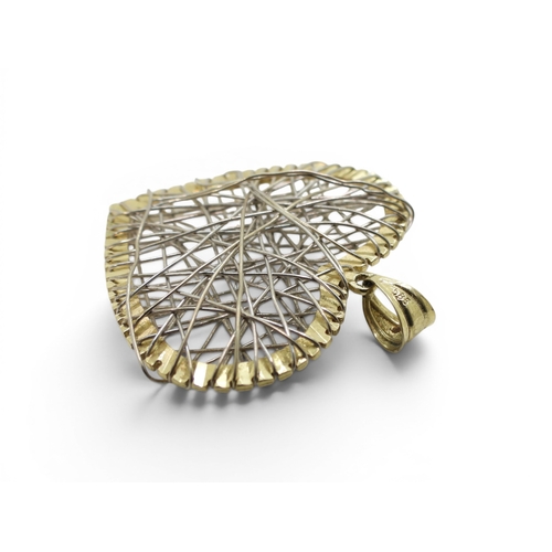 708 - A 14k gold heart pendant with wire work design, weight 6.1gms