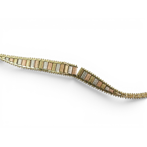 712 - A collection of 9ct gold items, a wishbone pendant, a tricolour bracelet, a 'J' pendant and a St. Ch... 