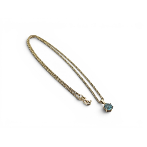 714 - A 9ct gold blue zircon pendant made by Cropp & Farr, together with a 46cm, 9ct gold fancy rope c... 