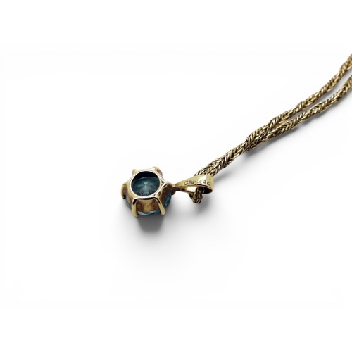 714 - A 9ct gold blue zircon pendant made by Cropp & Farr, together with a 46cm, 9ct gold fancy rope c... 