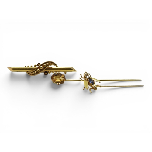 716 - A 15ct gold bar brooch length 4.8cm, weight 2.4gms, together with a 9ct gold brooch in the shape of ... 