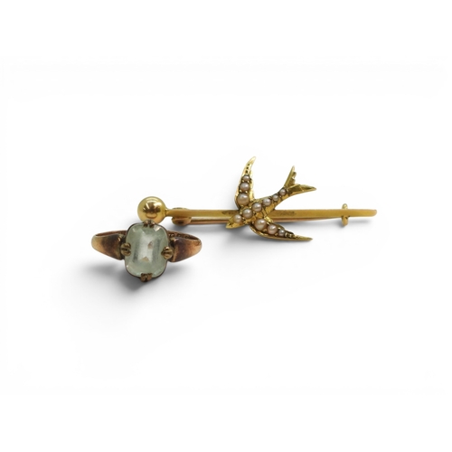 719 - A bright yellow metal pearl swallow bird brooch, weight 3gms, together with a 9ct blue glass gem rin... 