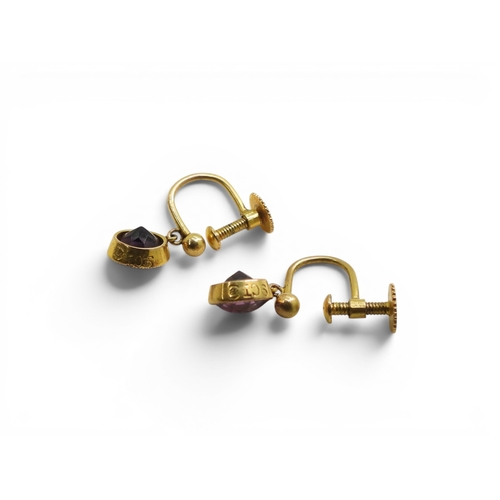 722 - A collection of gold and yellow metal mounted items to include;- a pair of 9ct amethyst earrings by ... 