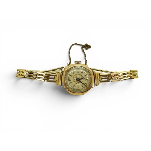 724 - A 9ct gold ladies Audax watch and strap, weight including 9ct strap and the mechanism 15.4gms