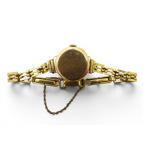 724 - A 9ct gold ladies Audax watch and strap, weight including 9ct strap and the mechanism 15.4gms