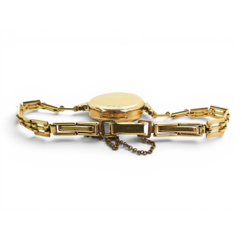 724 - A 9ct gold ladies Audax watch and strap, weight including 9ct strap and the mechanism 15.4gms