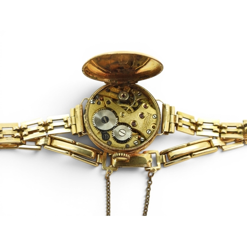 724 - A 9ct gold ladies Audax watch and strap, weight including 9ct strap and the mechanism 15.4gms