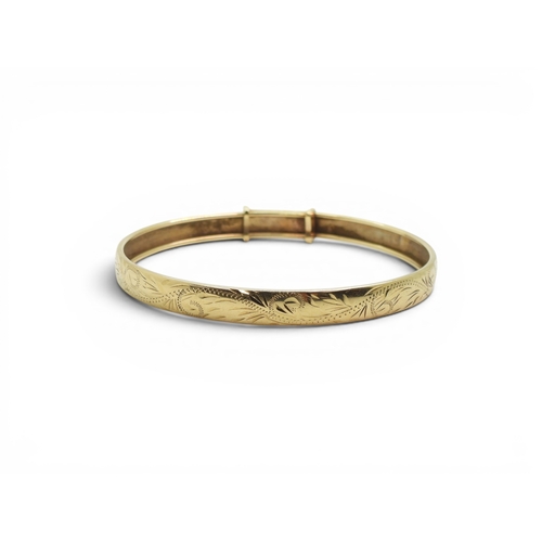 728 - A 9ct gold expanding bangle, with engraved pattern, weight 7.2gms