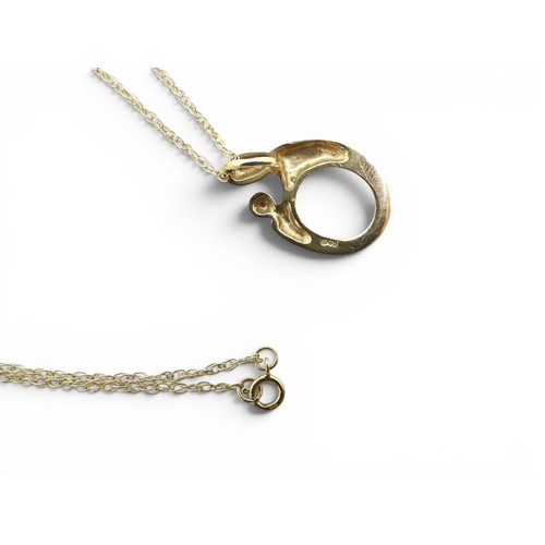 729 - A 9ct gold Mother & Child pendant and chain by Janet Russell, and a 9ct gold 43cm belcher chain,... 